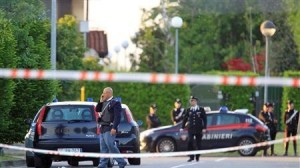 Italian Carabinieri with bulletproof vests stand in front of the office of Equitalia in the northern Italian city of Bergamo May 3, 2012. REUTERS/Alessandro Garofalo