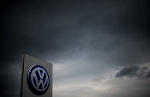 The logo of German car maker Volkswagen can be seen as dark clouds hang in the sky over a Volkswagen trader in Hanover, central Germany, on September 22, 2015. Share prices on the Frankfurt stock exchange fell more than 3.0 percent in midday trading on September 22, 2015, pushed down by index heavyweight Volkswagen, as it ploughed ever deeper into a pollution cheating scandal. AFP PHOTO / DPA / JULIAN STRATENSCHULTE +++ GERMANY OUT